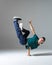 Cool b-boy dancing breakdance on the floor in studio  on gray background. Breakdancing school poster