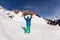 Cool boy hold ski on lifted hands at skiing resort