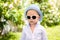 Cool child in sunglasses oudoor. Summer stylish trendy boy or kids fashion concept.