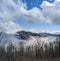 Cool clouds over and on mountains.