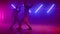 Cool couple dancing playfully in nightclub. Stylish dancers moving body on stage