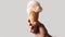 Cool and Creamy Delight, A Mans Hand Holding a Scoop of Milk Ice Cream on a Waffle Cone. Generative AI