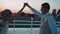 Cool dance of lovers on the background of sunset on the pier.