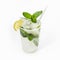 Cool delicious mojito cocktail decorated with mint and a slice of lime. Close-up, on a white background. Mock up