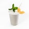 A cool delicious Pina colada decorated with mint and a slice of pineapple. Close-up, on a white background. Mock up