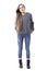 Cool funky young stylish woman in gray sweater and jeans posing with hands in back pockets.