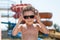 Cool funny cute kid in sunglasses in water park in summer sunny day