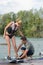 Cool girl wakeboarding cutting water surface with hand