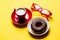 Cool glasses, tasty glazed donut and cup of coffee on plates on