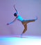 Cool guy breakdancer dancing hip-hop in lilac neon light in studio. Colorful dance school poster. Break dance lessons