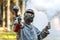 Cool guy with paintball gun and smoke grenade