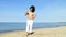 Cool handsome dancer having fun on the beach in summer