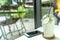 Cool lemon juice in plastic glass on white table