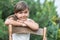 Cool little girl is leaning on an vintage wooden chair