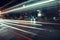 Cool long exposure bus traffic neon blue-orange light trails, night view on the street road, Rome, Italy