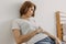 Cool looks woman in white t-shirt and jean relax in her apartment room.