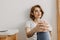 Cool looks woman in white t-shirt and jean relax in her apartment room.