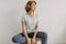 Cool looks woman in white t-shirt and jean relax in her apartment room.