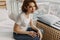 Cool looks woman in white t-shirt and jean relax in her apartment room.