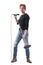 Cool macho handsome rock music singer holding and singing on microphone carrying stand.