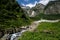 Cool mountain stream flowing from under the glacier. Highland pass