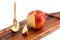 Cool organic fresh red apple wooden tray with fork on w