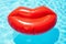 Cool red inflatable rubber lips swimming pool float. Summer vacation. Generative ai