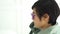 Cool stylish Asian woman short hair ear piercing purple sunglasses