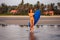 Cool surfer girl perfect fit body in teaching and practicing surfing class.young and beautiful woman in bikini swimsuit