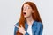 Cool take a look. Close-up portrait fascinated and excited cute redhead woman in glasses checking out awesome banner