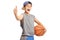 Cool teenage boy with a basketball showing thumbs up