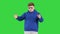 Cool teenager in stylish glasses and casual clothes telling a story to camera on a Green Screen, Chroma Key.