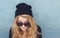 Cool teenager wtih wool hat and sunglasses