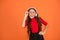 Cool track. Girl with eyeglasses orange background. Event and entertainment. Party girl. Party accessory. Having fun