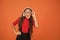 Cool track. Girl with eyeglasses orange background. Event and entertainment. Party girl. Party accessory. Having fun