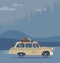 Cool vector modern retro car with suitcases luggage on roof rack. Tourism design.