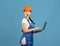 Cool Website. Portrait Of Shocked Handywoman In Hardhat And Coveralls Holding Laptop
