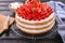 Cooling rack with delicious strawberry cake on wooden table