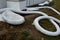 Cooling register of pipes under the ice surface. rows of frozen tubes. strong pipes, hoses are twisted on the lawn in the park. A