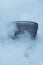 Cooling tower, covered in fog, of a petrochemical plant in Germany monochrome image