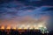 Cooling Tower of Oil and Gas Refinery Plant at Sunset. Process Buildings of Petrochemical Manufacturing., Business Engineering and