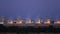 Cooling tower of oil refinery industrial plant at night