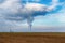 Cooling towers of nuclear power plant NPP Jaslovske Bohunice EBO in Slovakia. Clouds of thick smoke from chimneys on blue sky