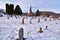 Coon valley cemetery in Winter with the 1876 evangelical Norwegian Lutheran church and drifters area bluffs covered in snow.