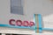 Coop logo brand and text sign on city market store wall facade cooperative supermarket