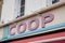 Coop logo brand and text sign on facade city market store cooperative supermarket