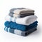 Coordinated comfort Stacked towels in blue, white, and gray showcase elegance