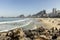 Copacabana beach with boulders and waves in the foreground