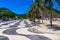 Copacabana with palms and mosaic of sidewalk in Rio de Janeiro