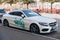 Copenhagen, 14 September 2020 - White Mercedes Benz vandalised by green spray paint parked at street in Copenhagen